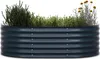 A dark grey raised garden bed filled with various plants, including rosemary and yellow flowers. Podgląd zdjęcia produktu