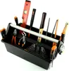 A black toolbox filled with various tools, including a level, hammer, pliers, wrenches, and screwdrivers, set against a white background. Podgląd zdjęcia produktu