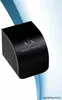 A black Armani Exchange watch box with the brand logo and name printed on it, set against a light blue and white gradient background. Anteprima dell’immagine prodotto