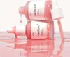 Two bottles of Medicube PDRN Pink Peptide Serum are stacked, with pink serum dripping from the top bottle onto the bottom bottle and into a pool of pink liquid below. Voir les images du produit