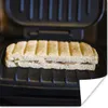 MuchoWow® Poster Toast auf einem schwarzen Sandwicheisen Produktbild-Vorschau 1