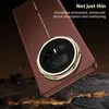 A close-up of a smartphone case with a camera module, set against a dark, rocky background with glowing embers. Produktbild-Vorschau