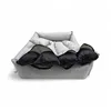 A dog bed with pillows inside, shown from a slightly elevated front-facing angle on a white background. Anteprima dell’immagine prodotto