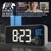 A digital alarm clock is shown with marketing text and an image of a person. Náhled obrázku produktu
