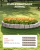 A garden bed with orange flowers bordered by stone-like edging, set in a grassy lawn. Voir les images du produit