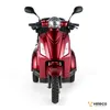 Front view of a red three-wheeled electric scooter against a white background. Produktbild-Vorschau