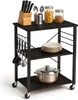 A kitchen cart with various kitchen items on it. Produktbild-Vorschau