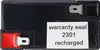 A close-up view of a black battery with red and silver terminals, and a white sticker with text. Podgląd zdjęcia produktu