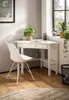 A white corner desk with a chair in a home office setting. Anteprima dell’immagine prodotto