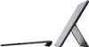 A portable wireless keyboard and a tablet are shown on a white background. The keyboard is flat on the left, and the tablet is propped up on its stand on the right. Náhľad obrázku produktu