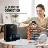 A woman is using a smartphone to control a VEVOR diffuser in a living room setting. Voir les images du produit