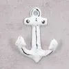 A white anchor-shaped hook is mounted on a light gray textured wall. Produktbild-Vorschau