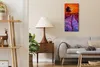 A living room scene with a couch, lamp, and shelves, featuring a wall clock. Produktbild-Vorschau
