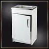 A white kitchen cabinet with a sink and an open door, set against a black background with a decorative border. Náhľad obrázku produktu
