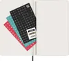 Stickers and year labels are laid out on an open notebook. Produktbild-Vorschau