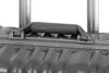 A close-up view of a suitcase handle and its attachment to the suitcase body. Podgląd zdjęcia produktu