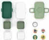 A flat lay of a disassembled bento box and decorative stickers. Produktbild-Vorschau