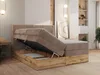 A bedroom scene with a bed that has its storage compartment open. Produktbild-Vorschau
