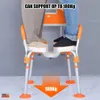 Two people standing on a shower chair to demonstrate its weight capacity. Podgląd zdjęcia produktu