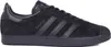 A single black Adidas Gazelle sneaker is shown from the side against a white background. Voir les images du produit