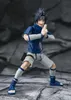 A collectible action figure of Sasuke Uchiha from Naruto, posed in a dynamic stance against a rocky background. Podgląd zdjęcia produktu