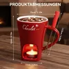 A red ceramic mug designed for hot chocolate fondue, with a candle holder at the base and measurement indicators. Produktbild-Vorschau