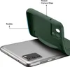 A dark green phone case is shown being peeled off a gray smartphone, highlighting its flexibility and raised camera edge. Produktbild-Vorschau