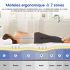 A woman is lying on a mattress which is shown in a cutaway view to illustrate its 7 zones of support. Voir les images du produit