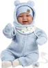 A baby doll dressed in a blue outfit with a hat and mittens, sitting against a white background. Produktbild-Vorschau
