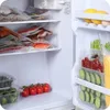 Inside of a refrigerator with various food items vacuum-sealed and stored on shelves and in door compartments. Podgląd zdjęcia produktu