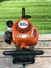 A close-up view of a Stihl hedge trimmer. Produktbild-Vorschau