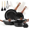 A collection of cookware and utensils arranged on a white background. Produktbild-Vorschau
