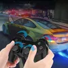 Hands holding a black game controller in front of a blurred image of a yellow sports car racing at night. Podgląd zdjęcia produktu