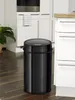 A black sensor trash can is shown in a kitchen setting. Produktbild-Vorschau