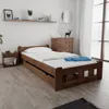 A bedroom scene with a wooden bed and nightstand. Náhled obrázku produktu