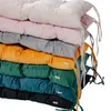 A stack of colorful cushions on a white background. Náhled obrázku produktu