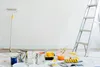 A room being prepared for painting, with painting supplies laid out on a drop cloth. Anteprima dell’immagine prodotto