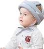 A baby wearing a protective helmet. Produktbild-Vorschau