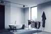 A modern bathroom with a bathtub, a drying rack with clothes, and a large window. Produktbild-Vorschau