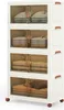 A stack of four white storage boxes with brown handles and transparent brown doors, each containing folded clothes. Náhled obrázku produktu