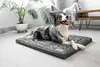 A dog is lying on a dog bed in a living room. Náhľad obrázku produktu