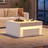 A modern living room scene at night with a couch and a coffee table. Voir les images du produit