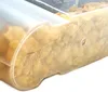 A close-up view of a transparent plastic food storage container filled with cereal. Produktbild-Vorschau