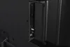 A close-up view of the ports on the back of a black television. Náhľad obrázku produktu