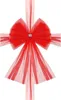 A red tulle bow with a sparkly embellishment in the center, set against a white background. Náhled obrázku produktu