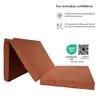 A folded mattress is shown against a white background, with text and certifications providing information about its safety and quality. Podgląd zdjęcia produktu