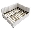 A beige upholstered bed frame with a slatted base, shown from a high angle. Náhľad obrázku produktu