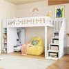 A child's loft bed with a wardrobe, shelves, and a beanbag chair in a bedroom setting. Anteprima dell’immagine prodotto