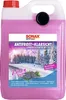 A large plastic container of pink liquid with a label showing a winter road scene and pine cones. Produktbild-Vorschau