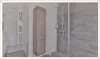 A modern bathroom with a tall cabinet and a shower. Produktbild-Vorschau